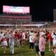 Arkansas OK’s field rushing — after 3-minute delay