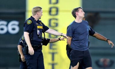 Security tackles baseball fan after he ran onto field, interrupting Astros-Orioles game