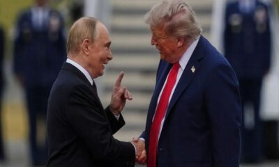 Trump and Putin exchange handshake as Alaska summit begins