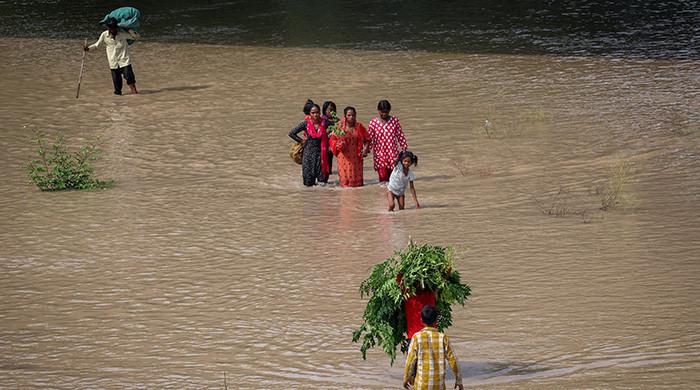 Heavy rain lashes northern India, Yamuna river breaches danger mark in Delhi Heavy rain lashes northern India, Yamuna river breaches danger mark in Delhi