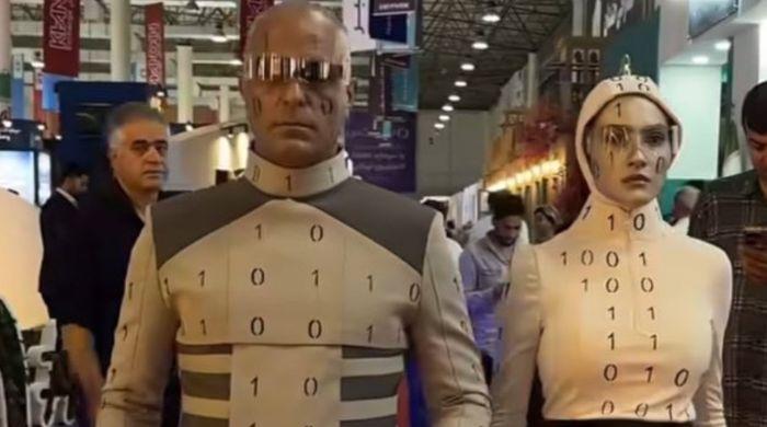 Iran tech expo’s advanced humanoid robots’ exposed as performers in costumes