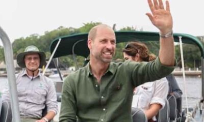 Prince William waves at crowd as he comes out of public toilet in Rio de Janiro