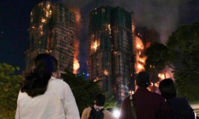 Fire engulfs Hong Kong residential blocks, killing at least 13