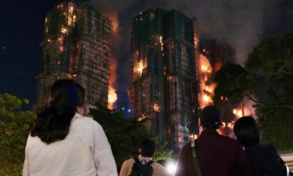 Fire engulfs Hong Kong residential blocks, killing at least 13