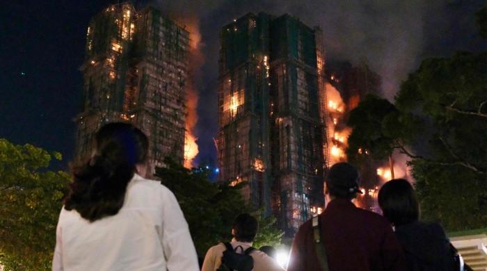 Fire engulfs Hong Kong residential blocks, killing at least 13