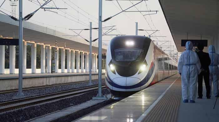 Train hits China railway workers, killing 11