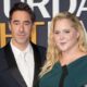 Amy Schumer, Chris Fischer still living together post split