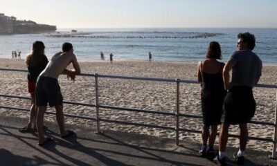 Australia plans gun buyback after Bondi massacre, as surfers honour victims