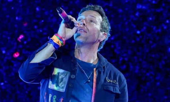 Chris Martin moves on from breakup headlines with wedding bliss