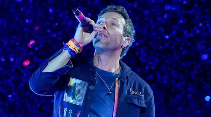 Chris Martin moves on from breakup headlines with wedding bliss