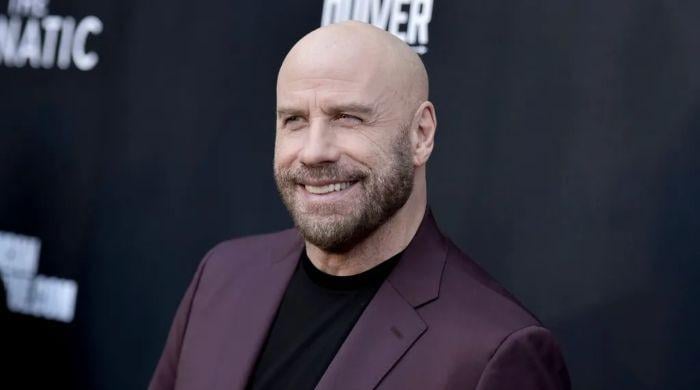 John Travolta gives ‘Greased Lightnin” a Santa-inspired revival