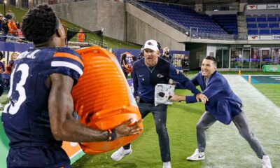 UTSA coach hilariously tries to escape celebration shower, ends up in dogpile