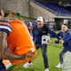 UTSA coach hilariously tries to escape celebration shower, ends up in dogpile