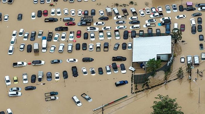 Race to get aid to Asia flood survivors as toll nears 1,200