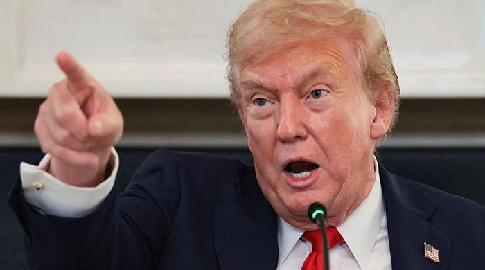 Trump warns of 25% tariff on nations trading with Iran