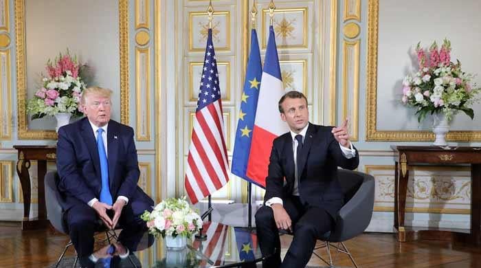‘We don’t give in to bullies’, Macron says after Trump salvo