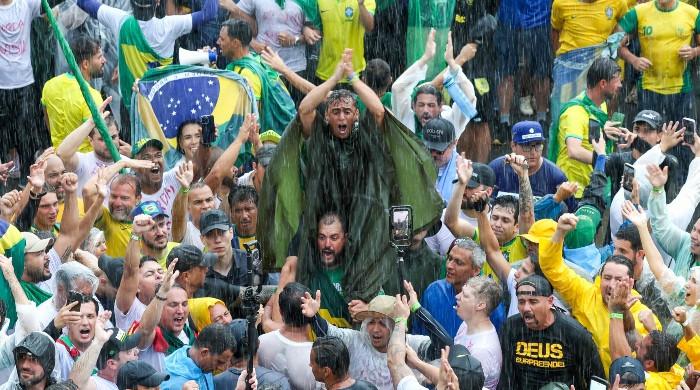 Lightning strike injures almost 100 at rally for Brazil’s former president