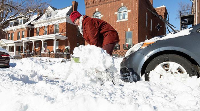 Millions dig out after US snowstorm; subfreezing temperatures to persist