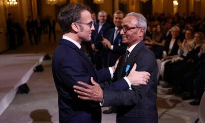 Read all about it! Macron gives honour to last newspaper hawker in Paris