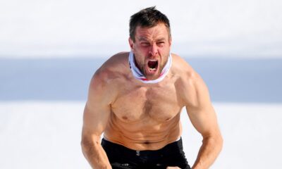 Austrian snowboarder strips down in cold temperatures during wild celebration after winning Olympic gold