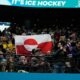 Olympic hockey fans raise Greenland’s flag during USA’s dominant win over Denmark, sparking viral reaction