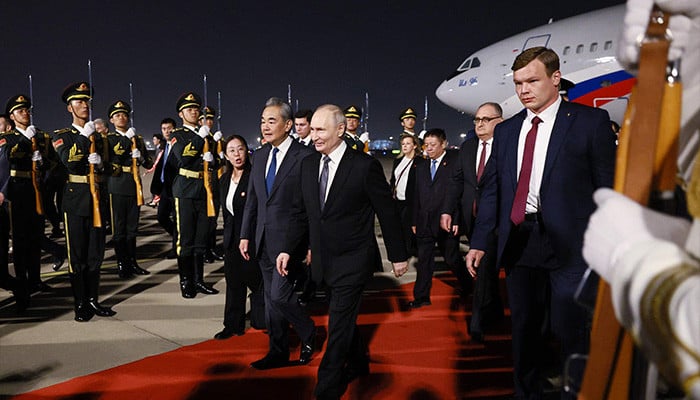 Putin lands in China for trip to show unshakeable ties after Trump pomp